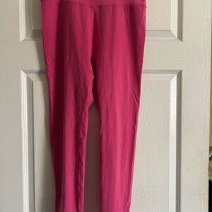 Hot pink Buff bunny workout leggings. 74% Nylon, 26% Spandex.
